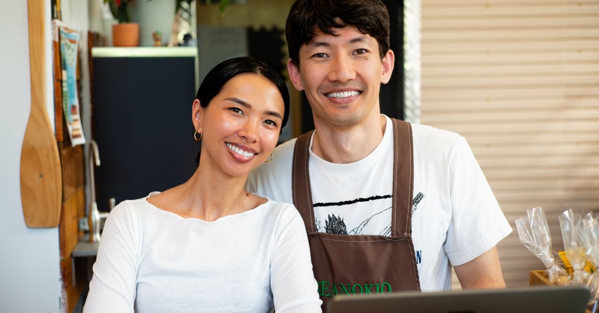 Independent café owners behind their counter